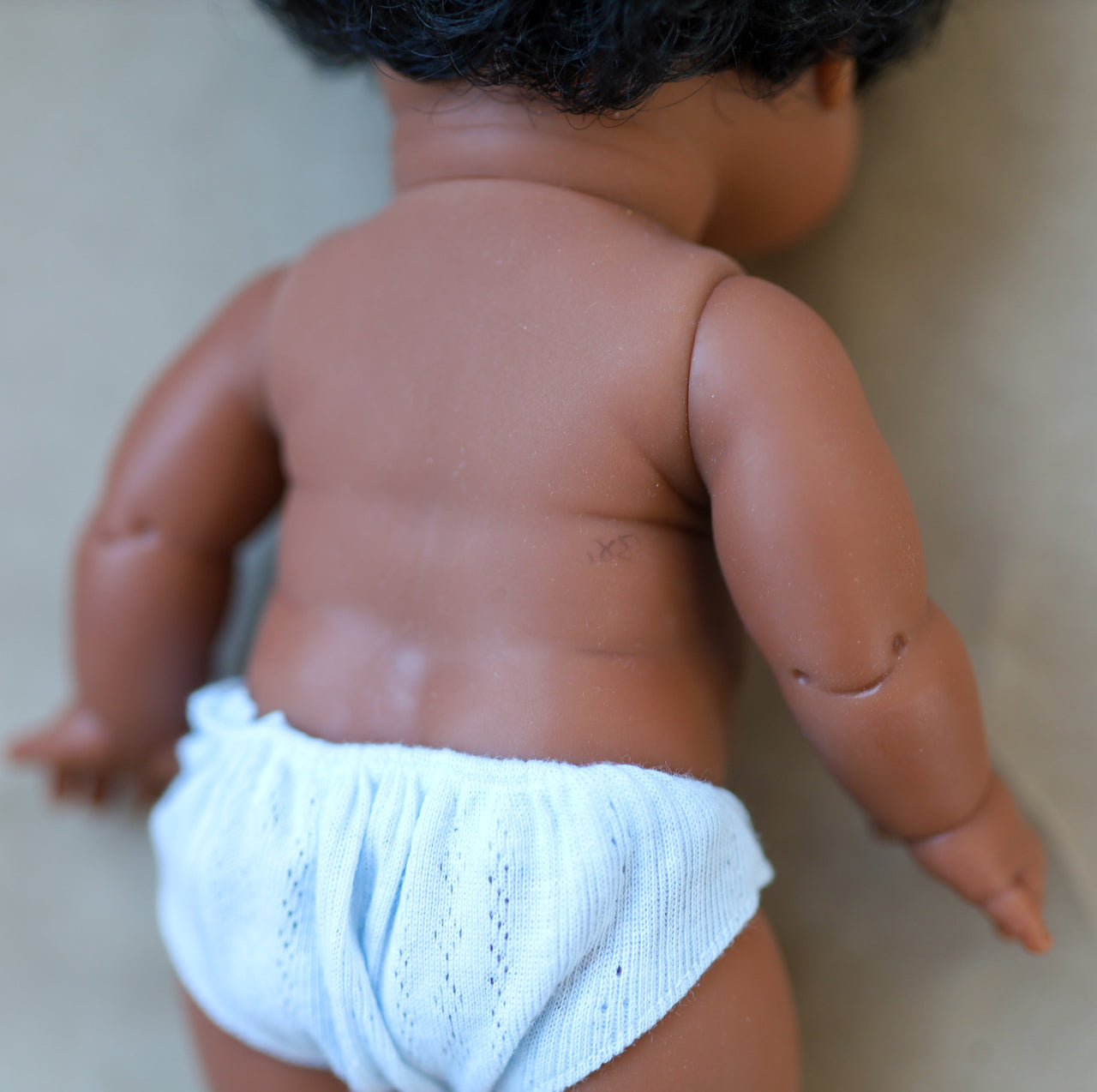 *Slightly Flawed* Minikane Jaro Black Baby Boy Doll with Brown Eyes
